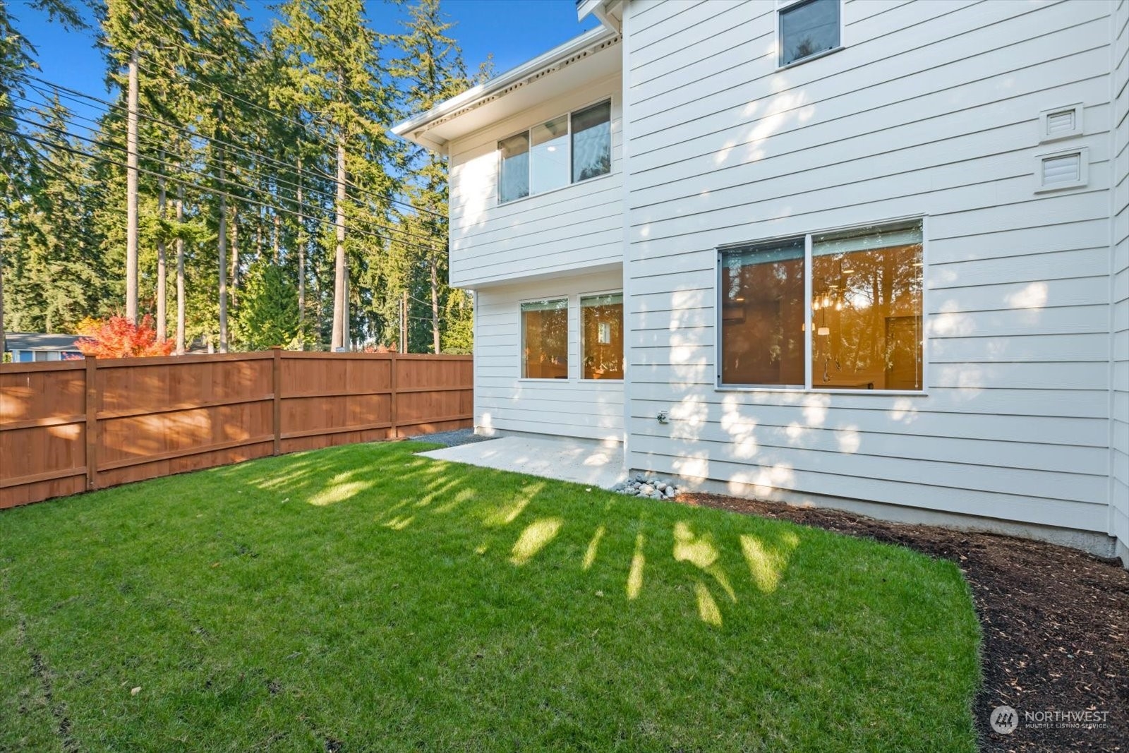 122 171st Place Southwest, Unit A Bothell, WA 98012 - Photo 24 of 26 a front view of a house with a yard