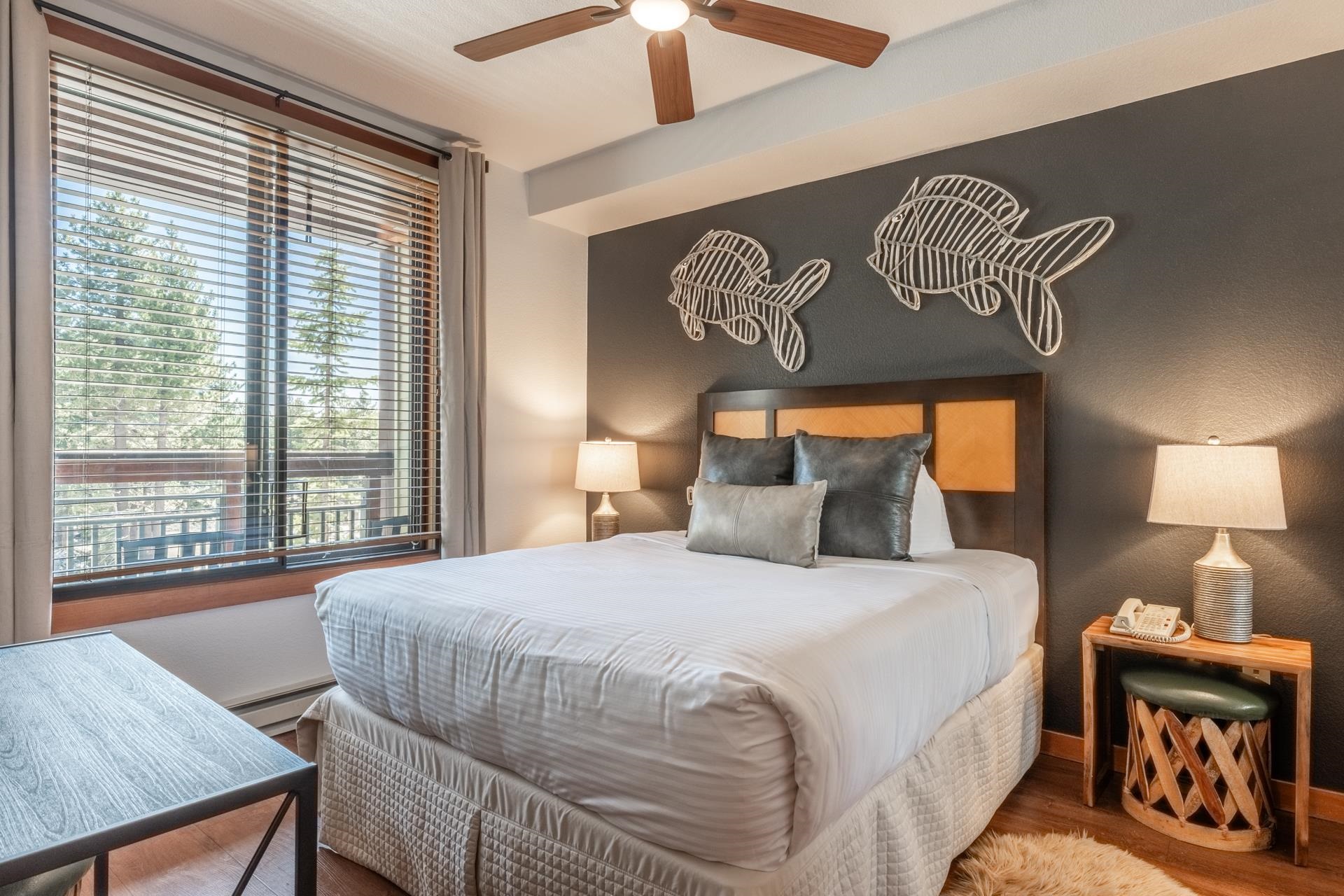 6201 Minaret Road, Unit 2221 Mammoth Lakes, CA 93546 - Photo 20 of 32 Bedroom featuring a large window with horizontal blinds, a brown wood headboard, a ceiling fan, and recessed lighting