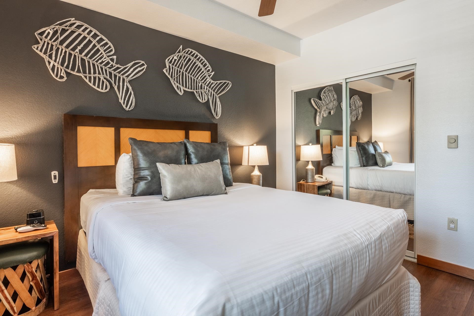 6201 Minaret Road, Unit 2221 Mammoth Lakes, CA 93546 - Photo 21 of 32 Bedroom featuring a wood-finish headboard against a textured accent wall
