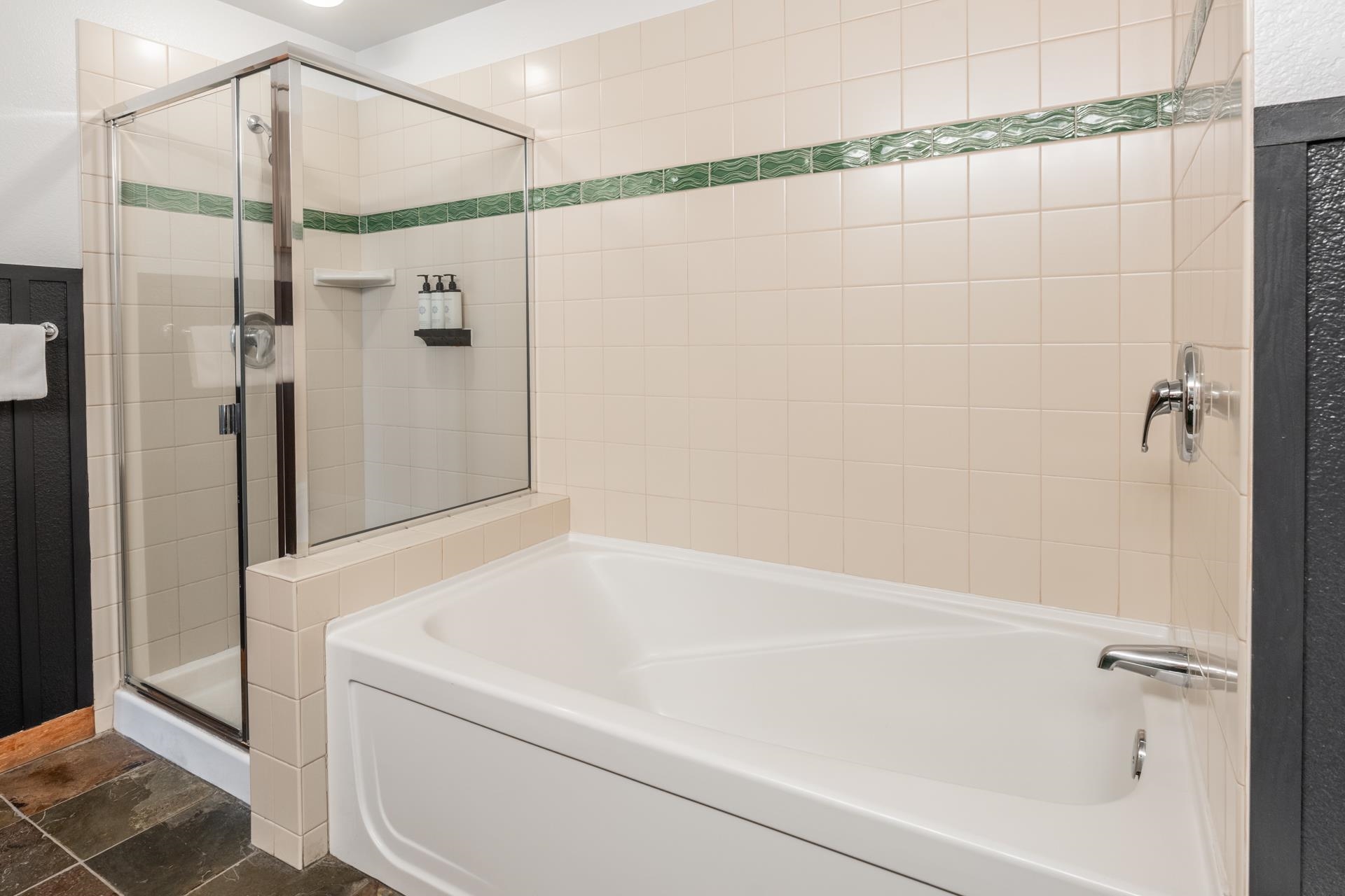 6201 Minaret Road, Unit 2221 Mammoth Lakes, CA 93546 - Photo 32 of 32 Glass-enclosed shower with a separate soaking tub and chrome fixtures