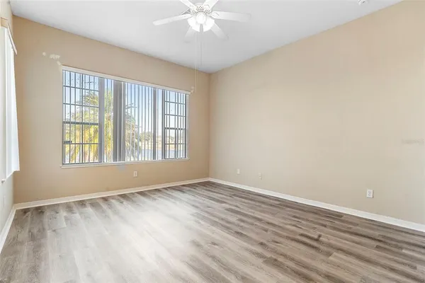 a spacious bathroom with a sink a mirror and a shower