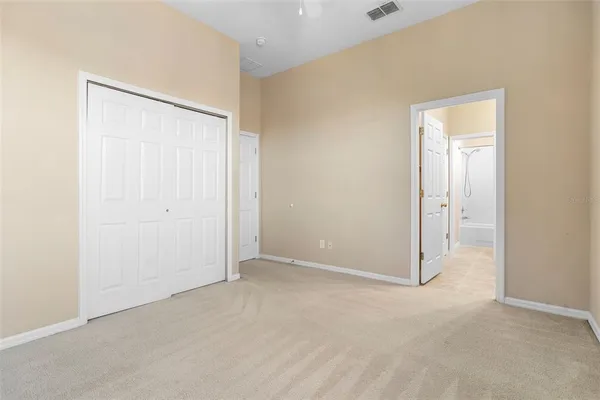 a bathroom with a granite countertop sink a mirror and a shower