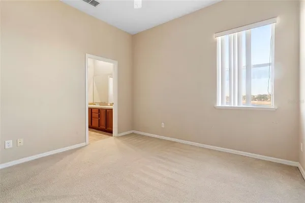 a bathroom with a granite countertop sink tub and a mirror