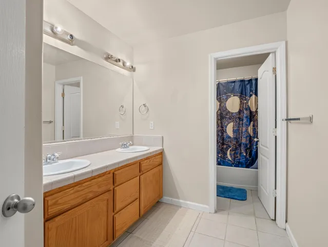 a bathroom with a sink a vanity and a mirror