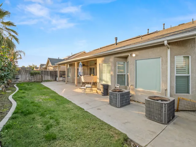 an aerial view of residential houses with city view and mountain view in back