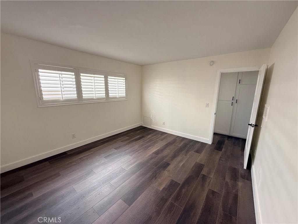 1522 Centinela Avenue, Unit 101 Los Angeles, CA 90025 - Photo 13 of 22 an empty room with wooden floor and windows