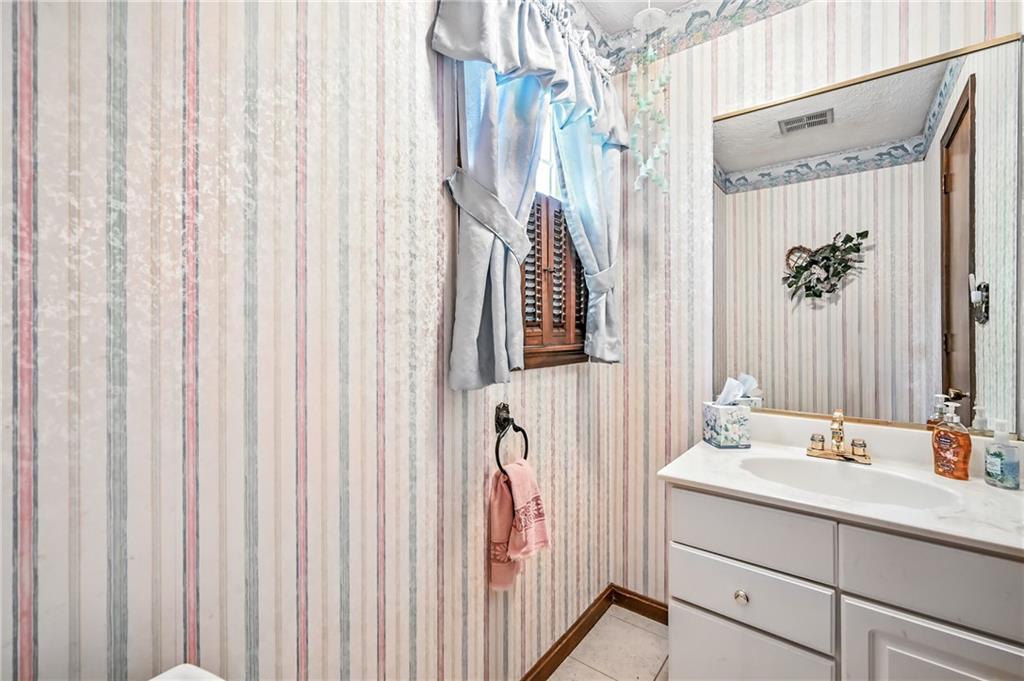 1471 George Street Hermitage, PA 16148 - Photo 28 of 49 a bathroom with a sink and a mirror