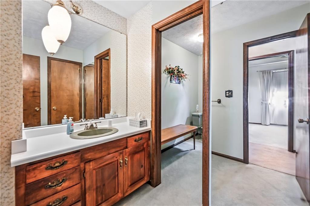 1471 George Street Hermitage, PA 16148 - Photo 39 of 49 a en suite bathroom with sink and mirror