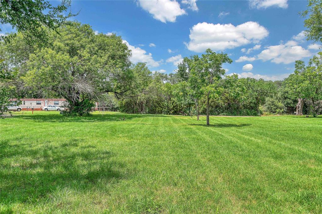 538 River Park Road McGregor, TX 76657 - Photo 5 of 6 a view of a green field with wooden fence