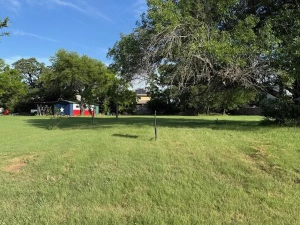 a view of outdoor space with deck and trees
