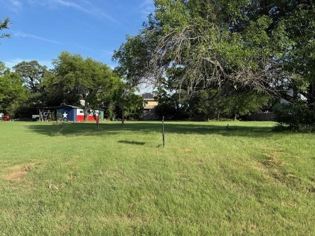 538 River Park Road McGregor, TX 76657 - Photo 6 of 6 a view of outdoor space with deck and trees