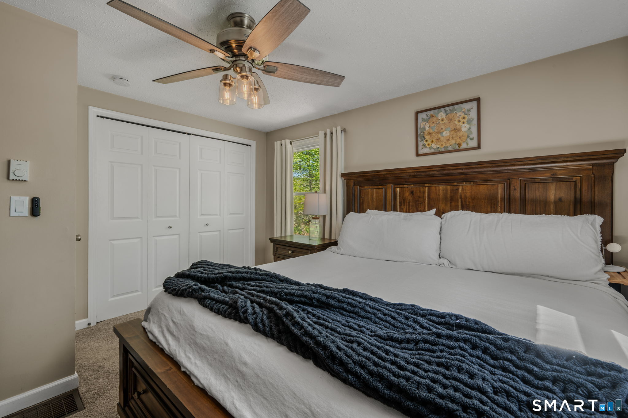 6 Amherst Court Groton, CT 06355 - Photo 23 of 40 a bedroom with a bed and a ceiling fan