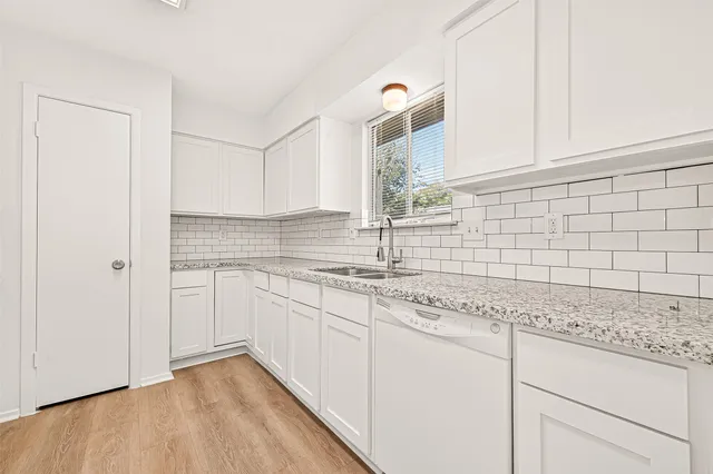 a kitchen with a stove and a refrigerator