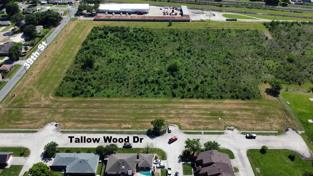 0 39th Street Port Arthur, TX 77642 - Photo 9 of 17 a view of a water pond with yard and large trees