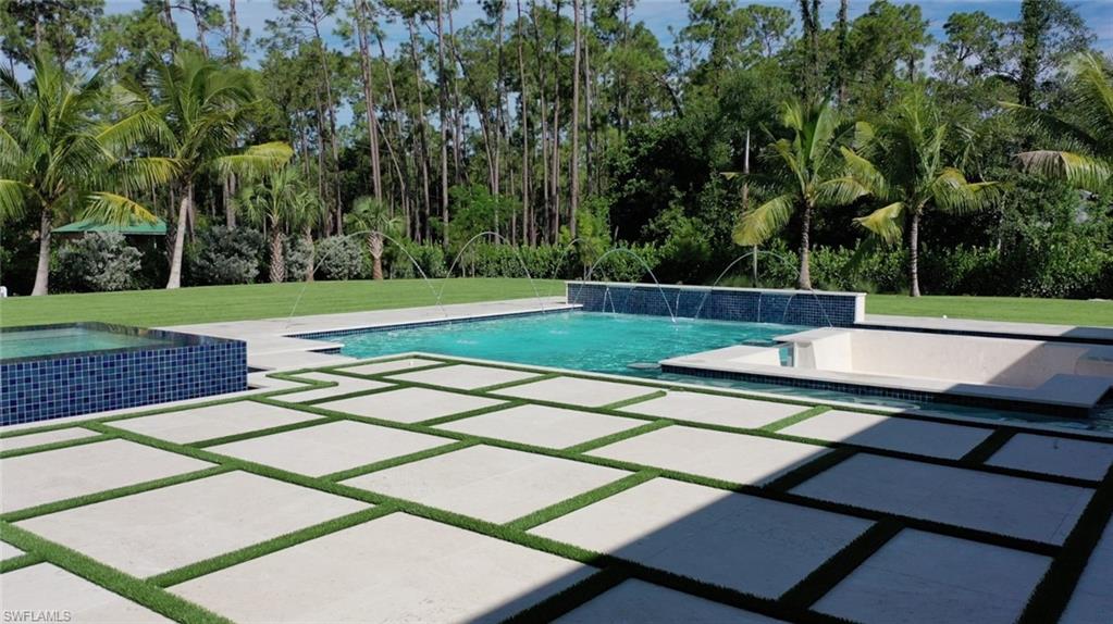 6435 Sable Ridge Lane Naples, FL 34109 - Photo 4 of 8 a view of a tennis court