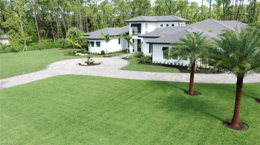 6435 Sable Ridge Lane Naples, FL 34109 - Photo 6 of 8 a view of a house with a yard