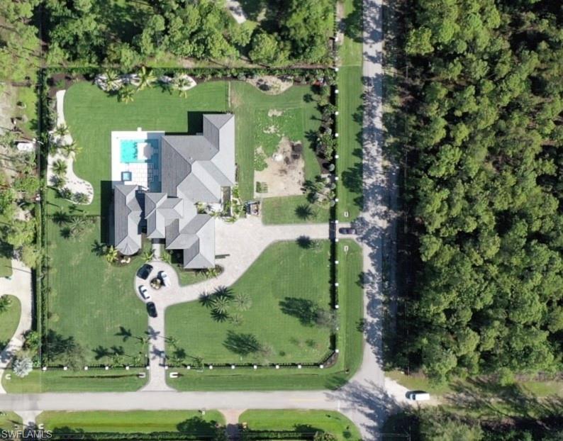 6435 Sable Ridge Lane Naples, FL 34109 - Photo 7 of 8 an aerial view of a house with a yard