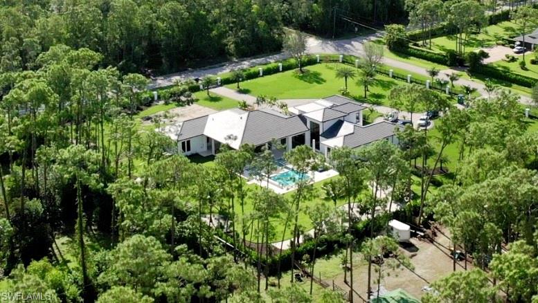6435 Sable Ridge Lane Naples, FL 34109 - Photo 8 of 8 an aerial view of a house with a yard