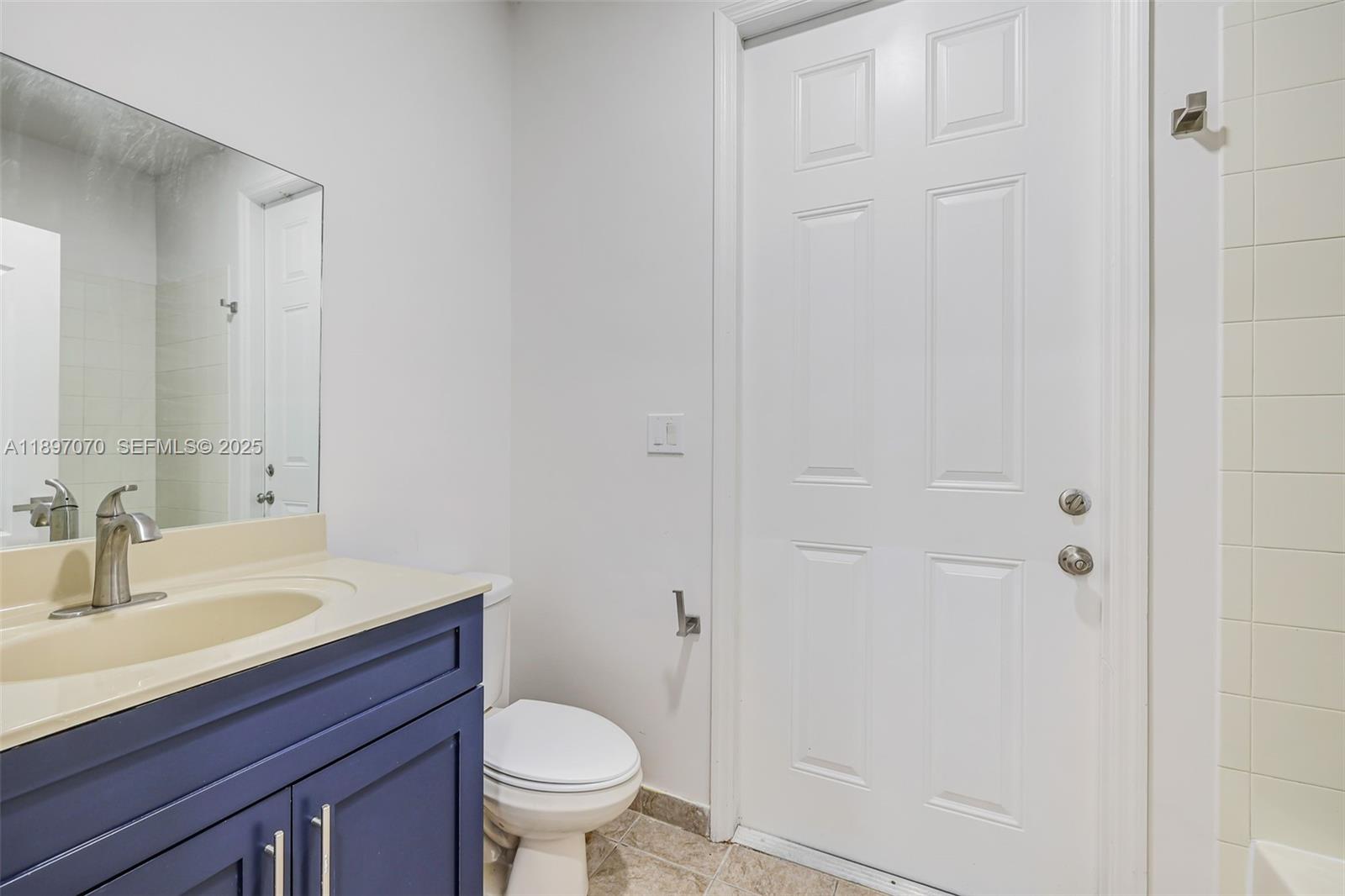 27381 Southwest 139th Place Homestead, FL 33032 - Photo 20 of 70 a bathroom with a sink toilet and vanity