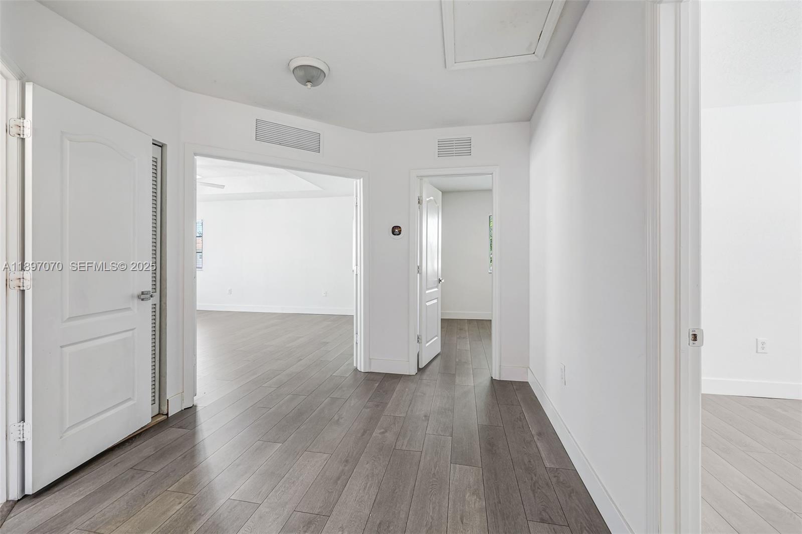 27381 Southwest 139th Place Homestead, FL 33032 - Photo 25 of 70 a view of a hallway with wooden floor