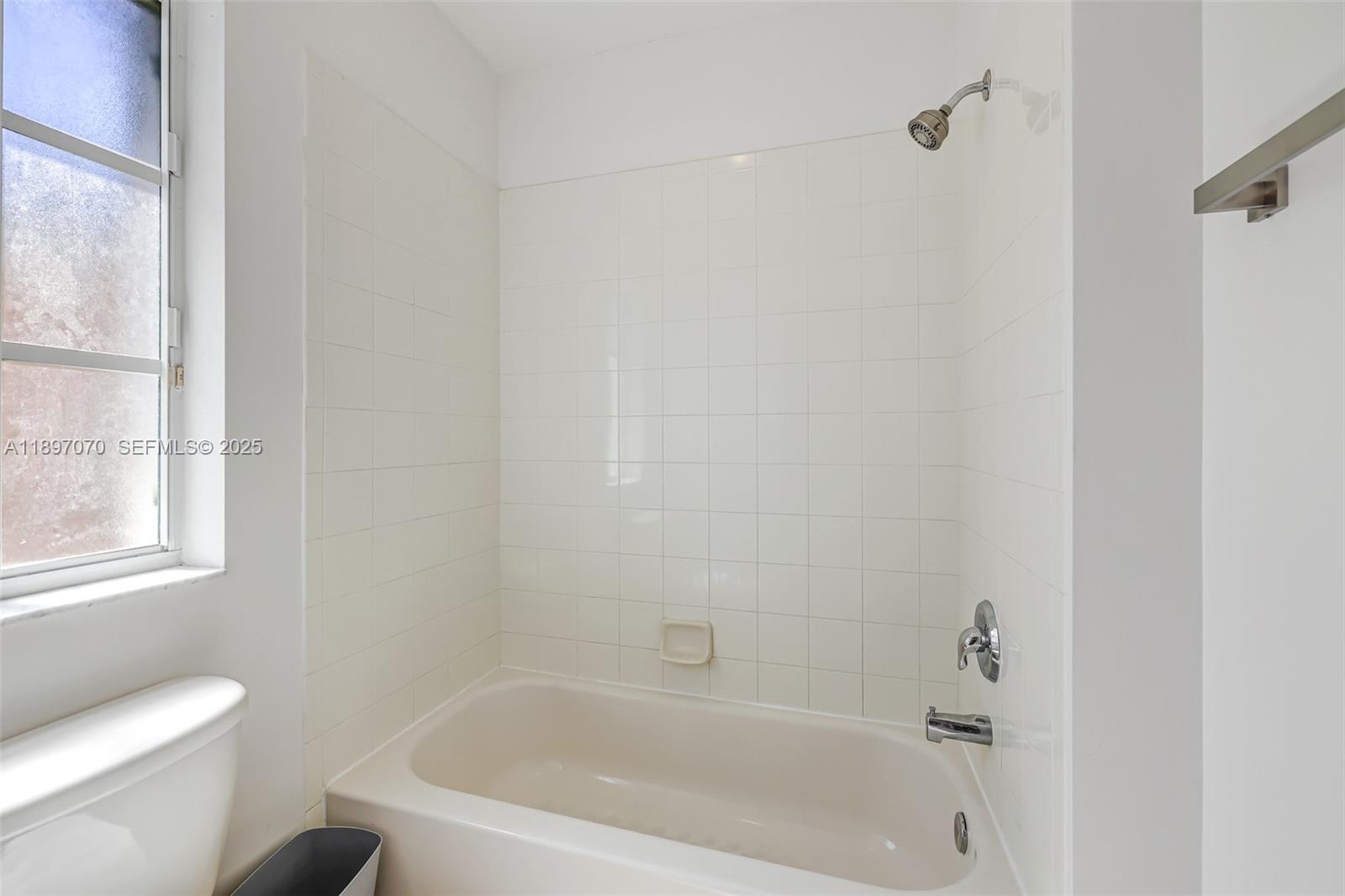 27381 Southwest 139th Place Homestead, FL 33032 - Photo 45 of 70 a white bath tub sitting next to a toilet