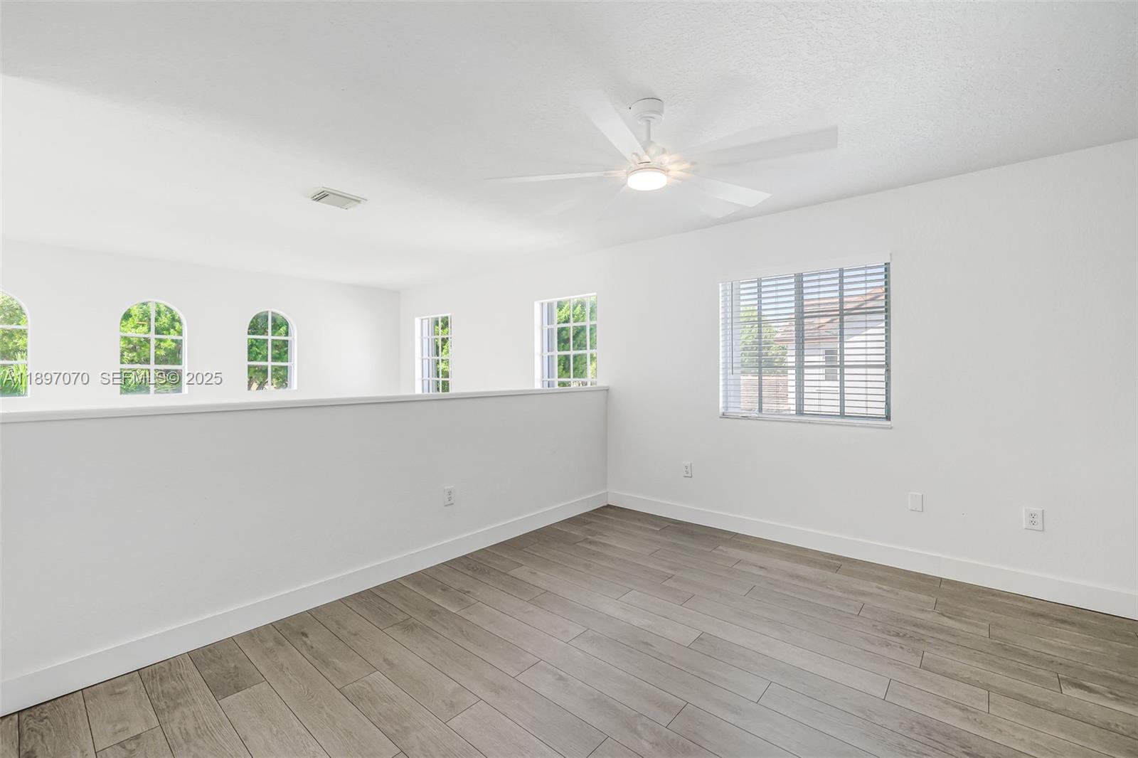 27381 Southwest 139th Place Homestead, FL 33032 - Photo 46 of 70 wooden floor in an empty room with window