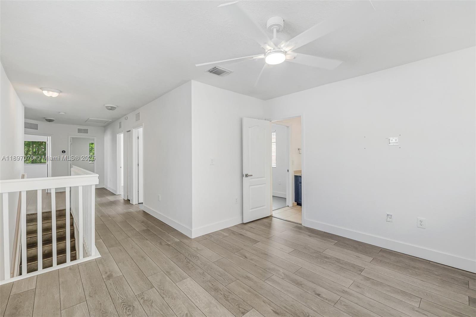 27381 Southwest 139th Place Homestead, FL 33032 - Photo 47 of 70 a view of an empty room with wooden floor
