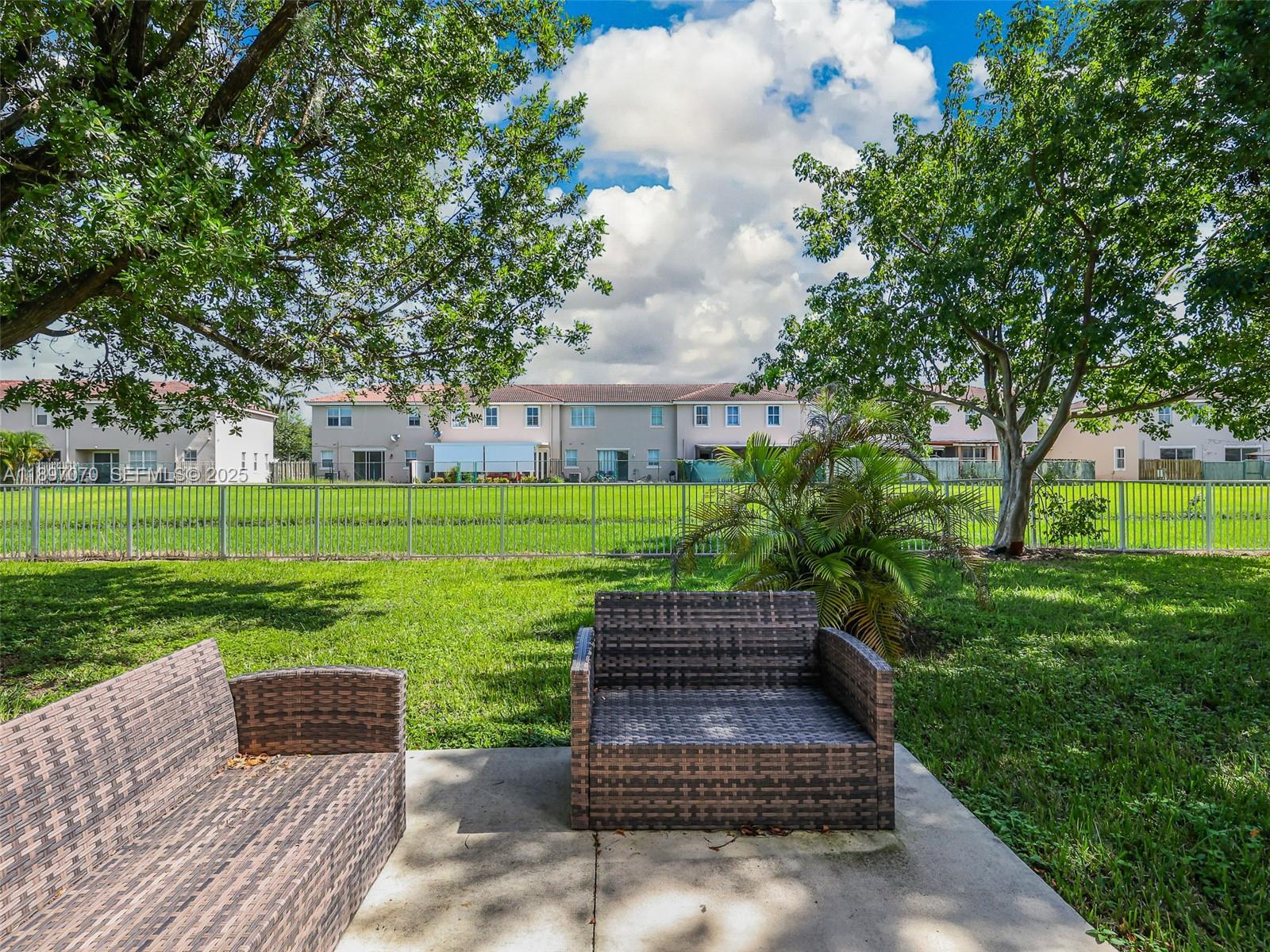 27381 Southwest 139th Place Homestead, FL 33032 - Photo 50 of 70 a view of a garden with wooden fence