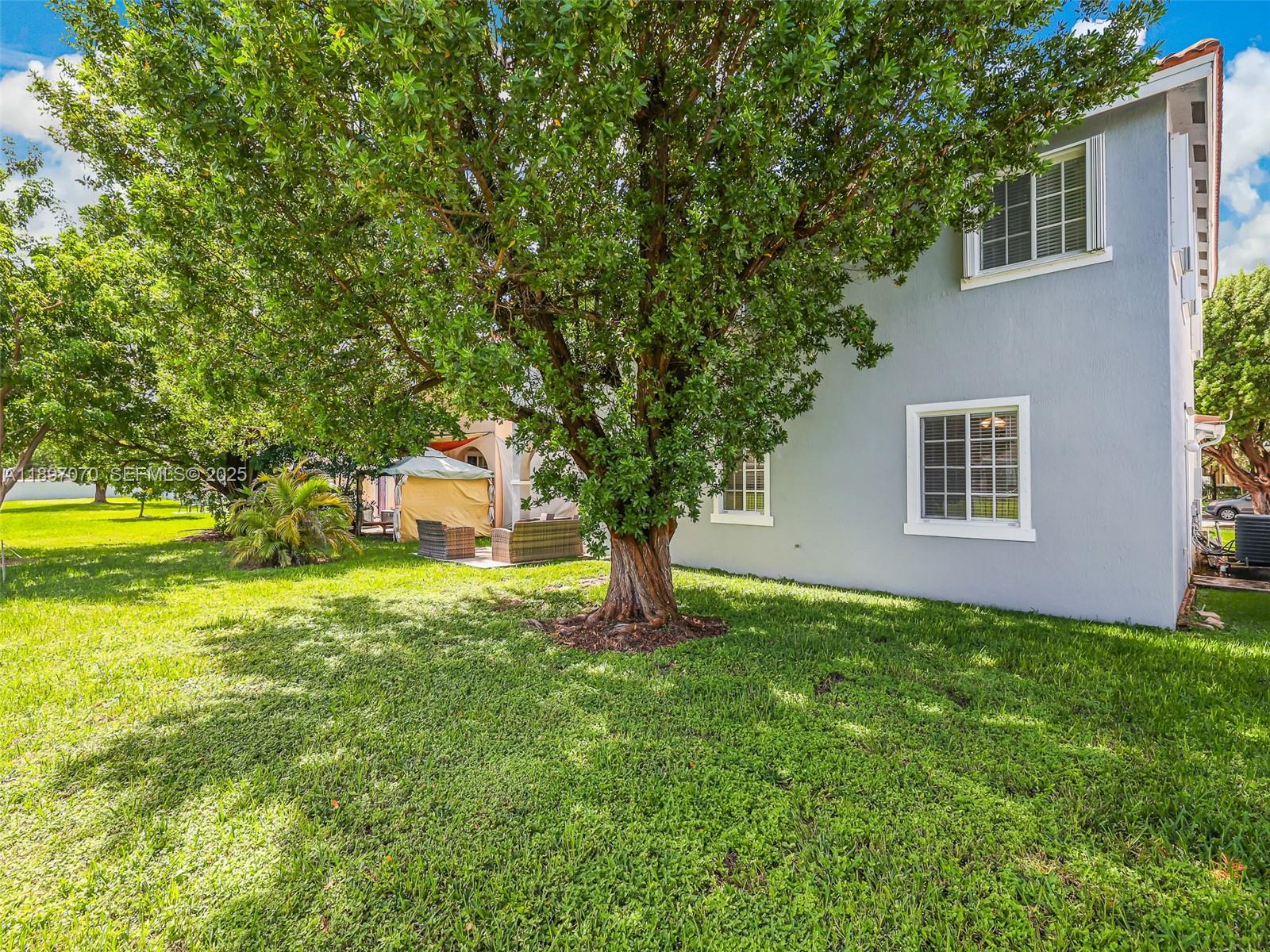 27381 Southwest 139th Place Homestead, FL 33032 - Photo 53 of 70 a front view of a house with garden