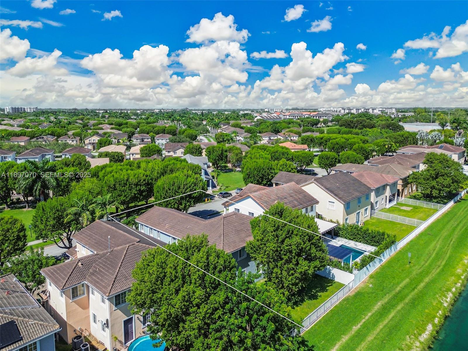 27381 Southwest 139th Place Homestead, FL 33032 - Photo 67 of 70 an aerial view of residential houses with outdoor space and river