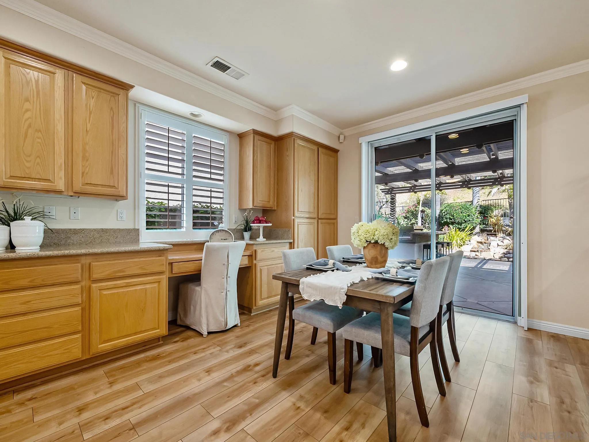 11361 Raedene Way San Diego, CA 92131 - Photo 13 of 57 a view of a dining room with furniture and window