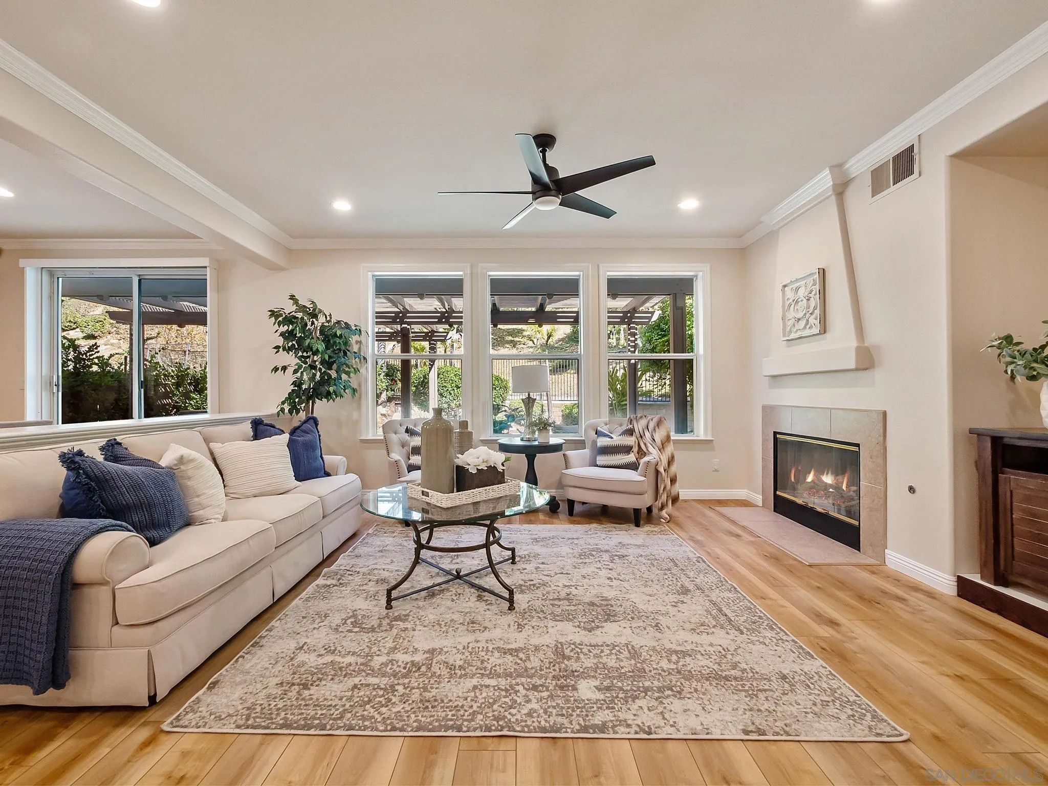 11361 Raedene Way San Diego, CA 92131 - Photo 16 of 57 a living room with furniture and a fireplace