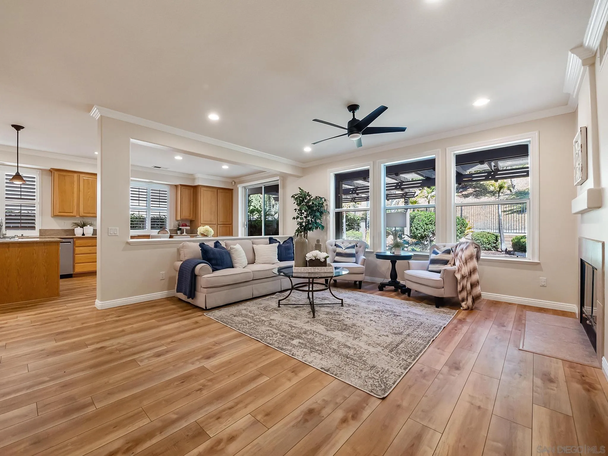 11361 Raedene Way San Diego, CA 92131 - Photo 18 of 57 a living room with furniture and large windows