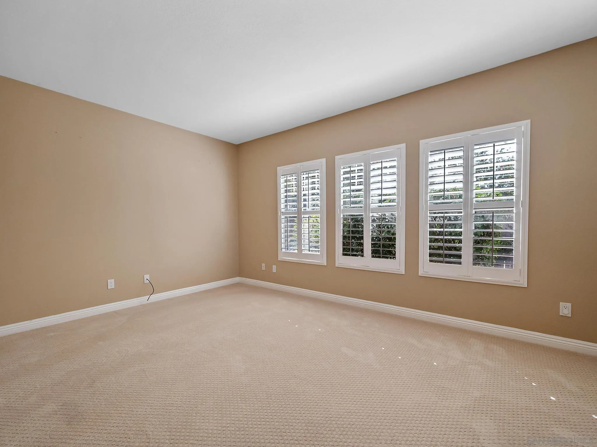 11361 Raedene Way San Diego, CA 92131 - Photo 19 of 57 a view of an empty room with a window