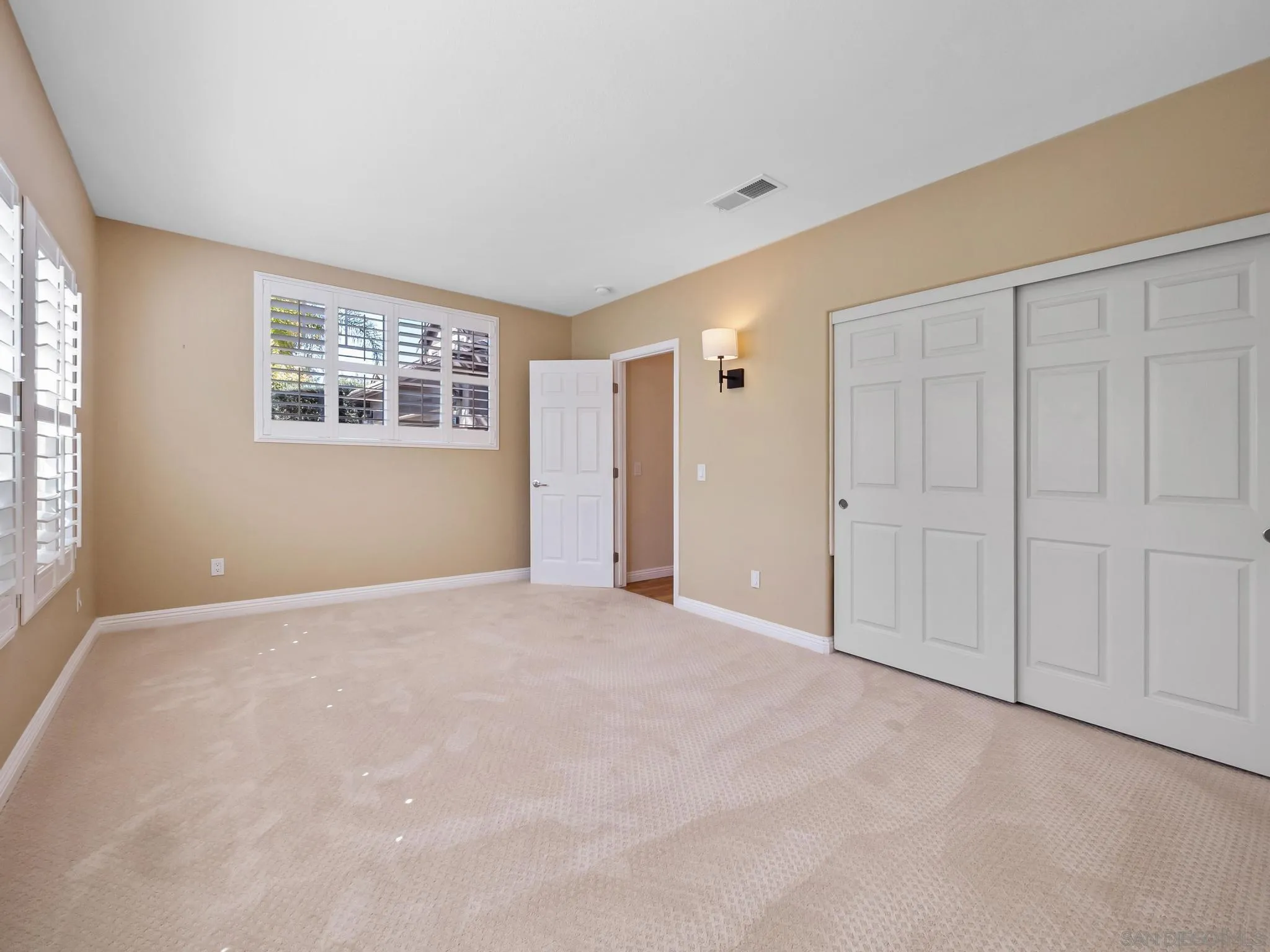 11361 Raedene Way San Diego, CA 92131 - Photo 20 of 57 an empty room with windows