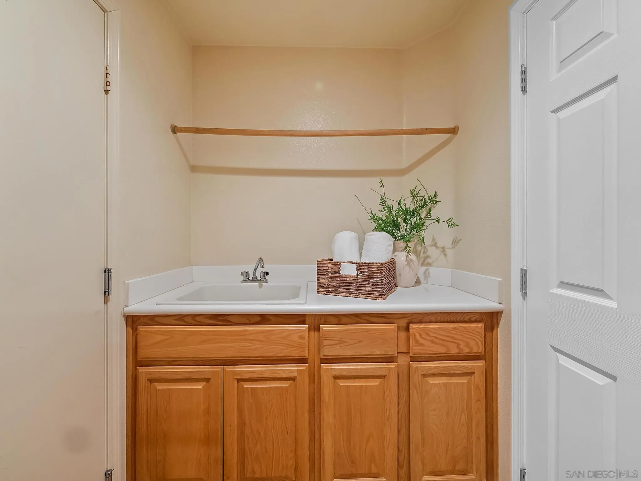 11361 Raedene Way San Diego, CA 92131 - Photo 22 of 57 a bathroom with a sink and a mirror