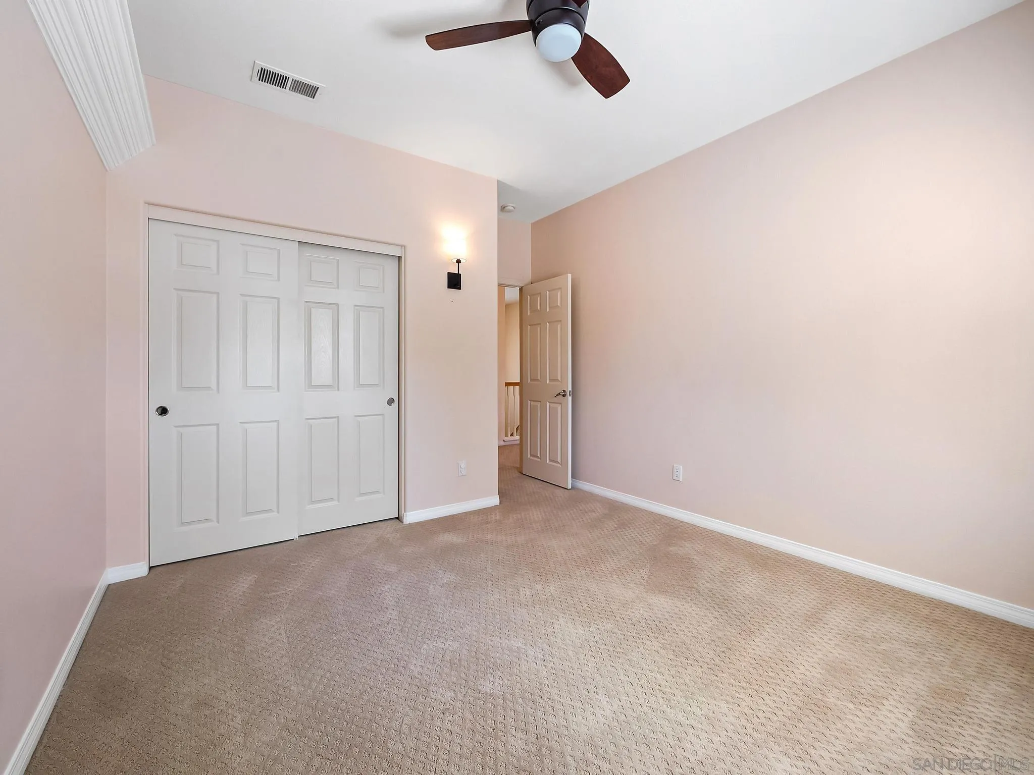 11361 Raedene Way San Diego, CA 92131 - Photo 27 of 57 an empty room with a empty space and a ceiling fan