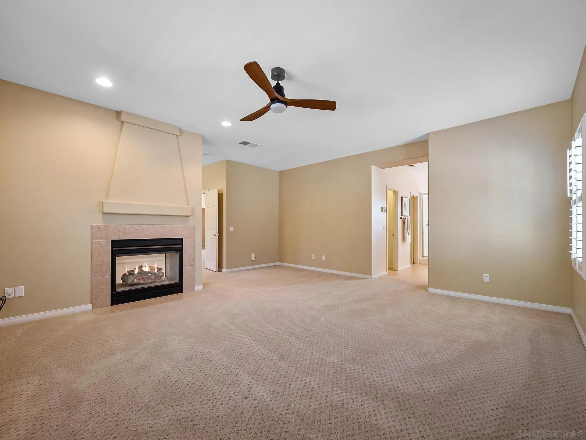 11361 Raedene Way San Diego, CA 92131 - Photo 31 of 57 a view of an empty room with a fireplace