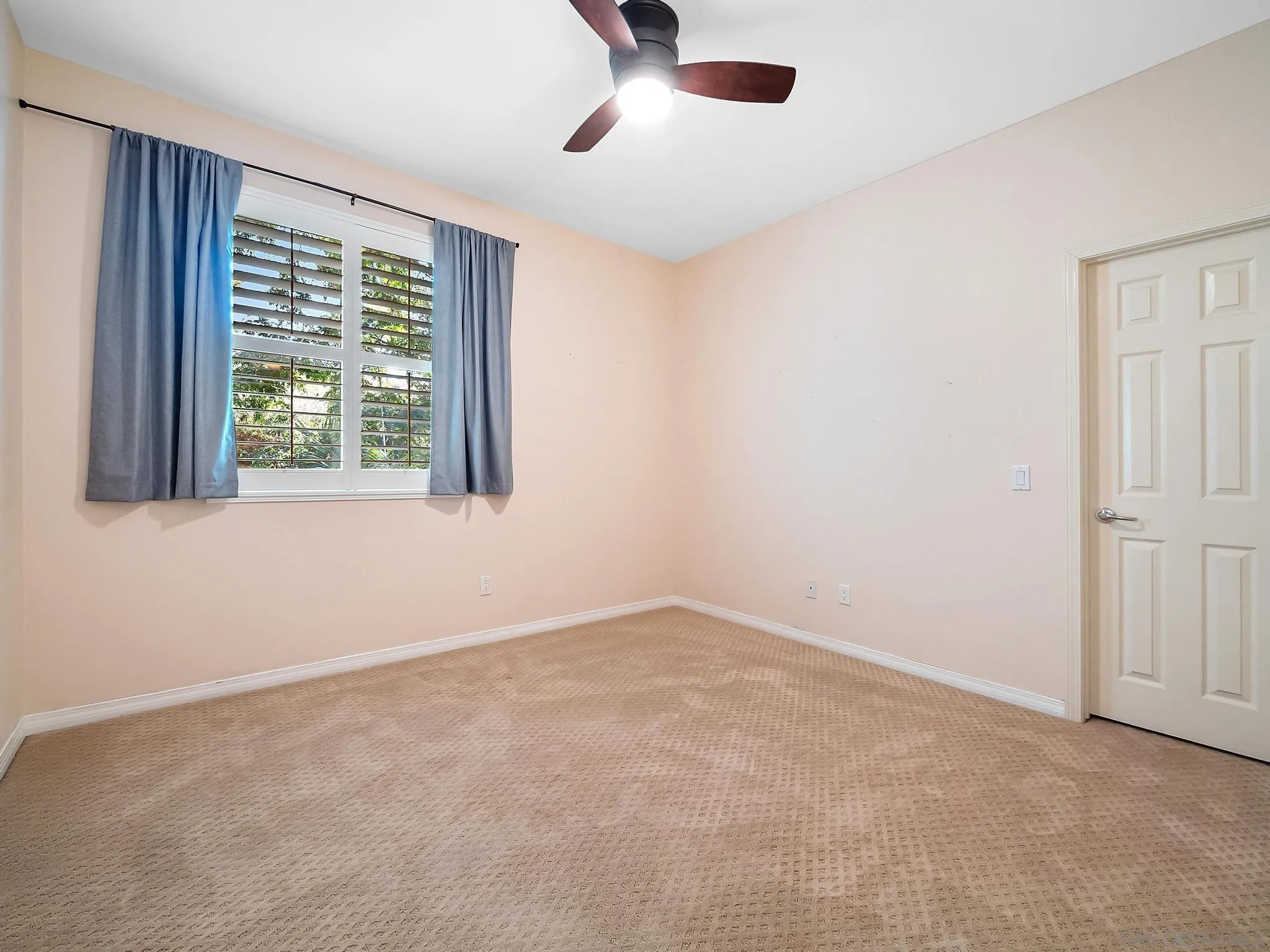11361 Raedene Way San Diego, CA 92131 - Photo 37 of 57 a view of an empty room with a window