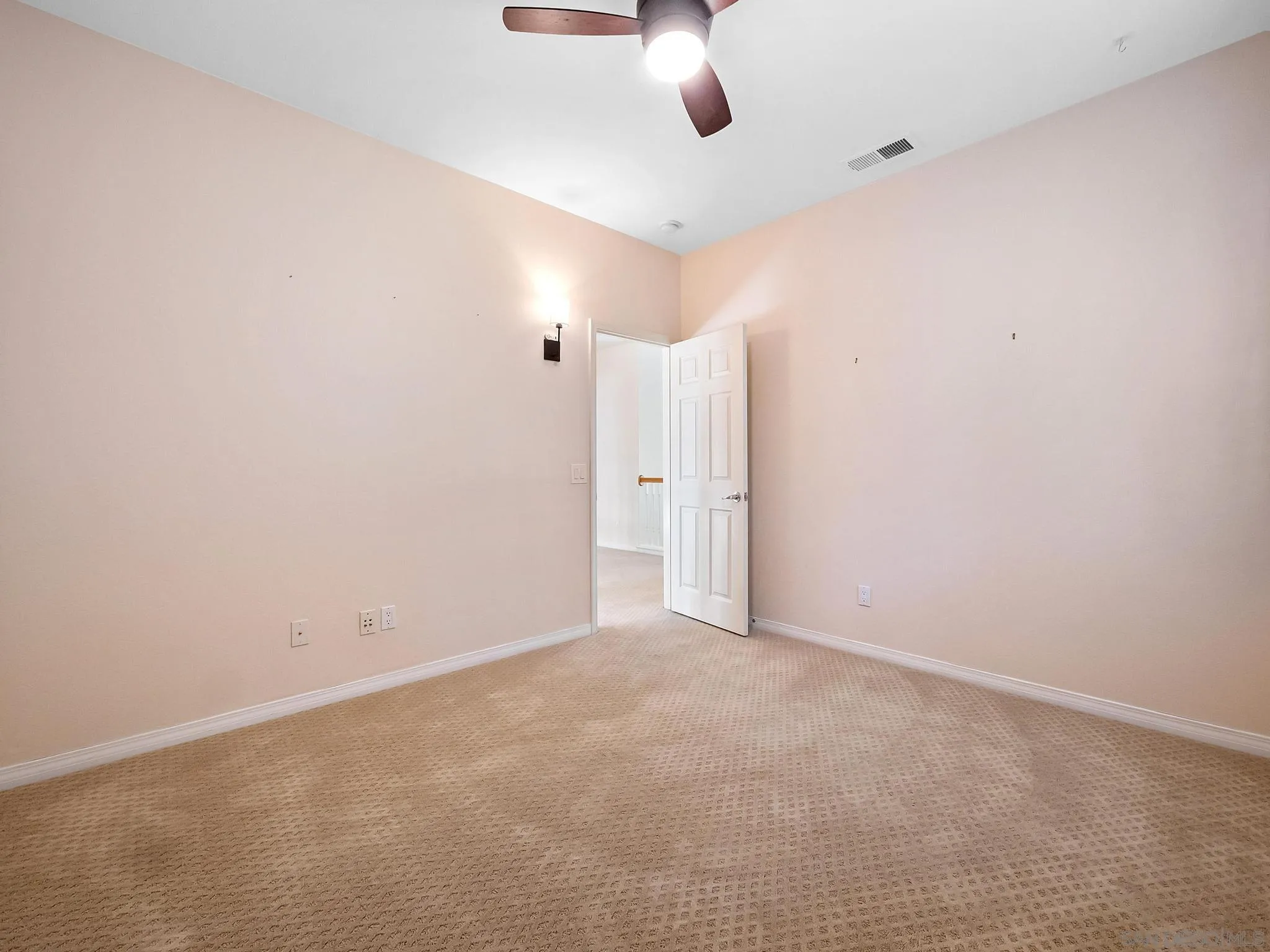 11361 Raedene Way San Diego, CA 92131 - Photo 38 of 57 an empty room with a ceiling fan and window