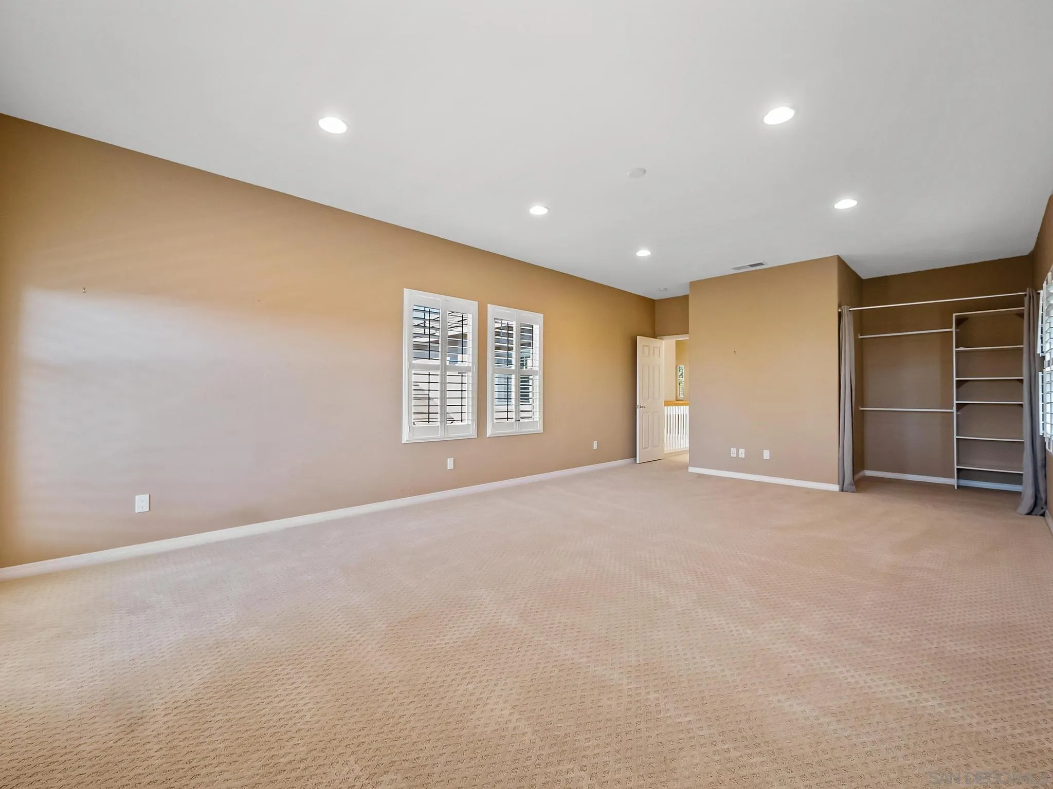 11361 Raedene Way San Diego, CA 92131 - Photo 40 of 57 a view of an empty room with a window