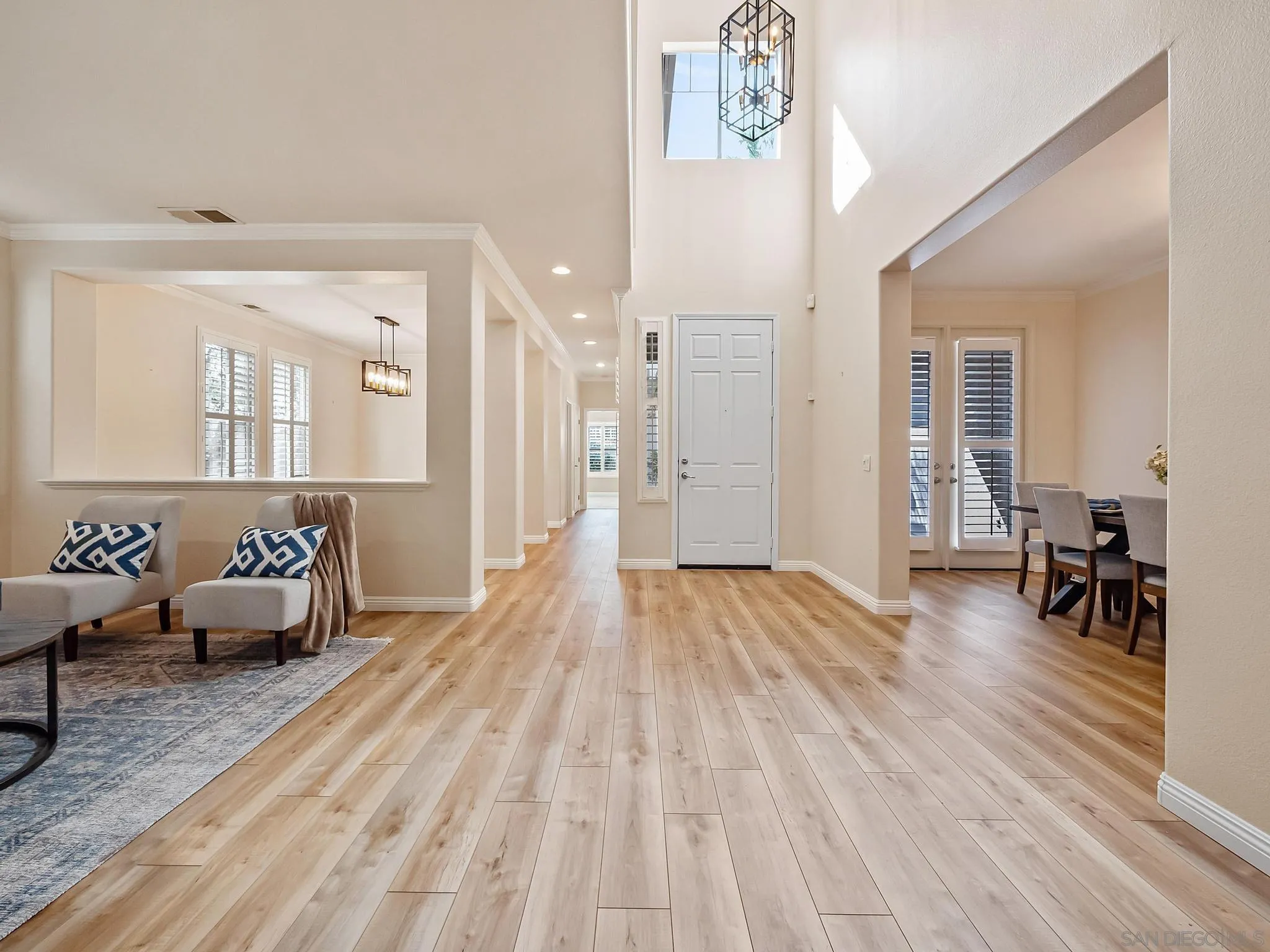 11361 Raedene Way San Diego, CA 92131 - Photo 4 of 57 a spacious bedroom with a bed and a table