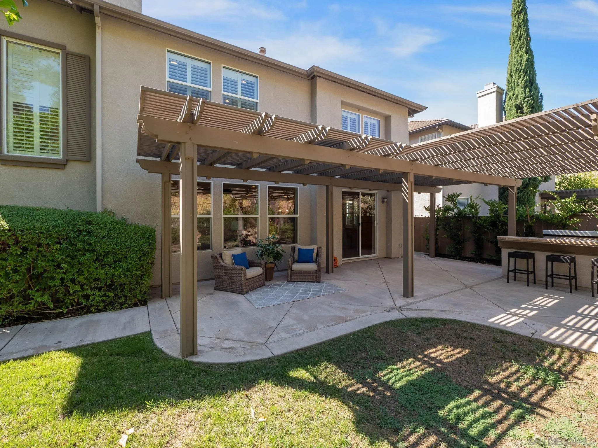 11361 Raedene Way San Diego, CA 92131 - Photo 46 of 57 a view of a house with backyard porch and sitting area