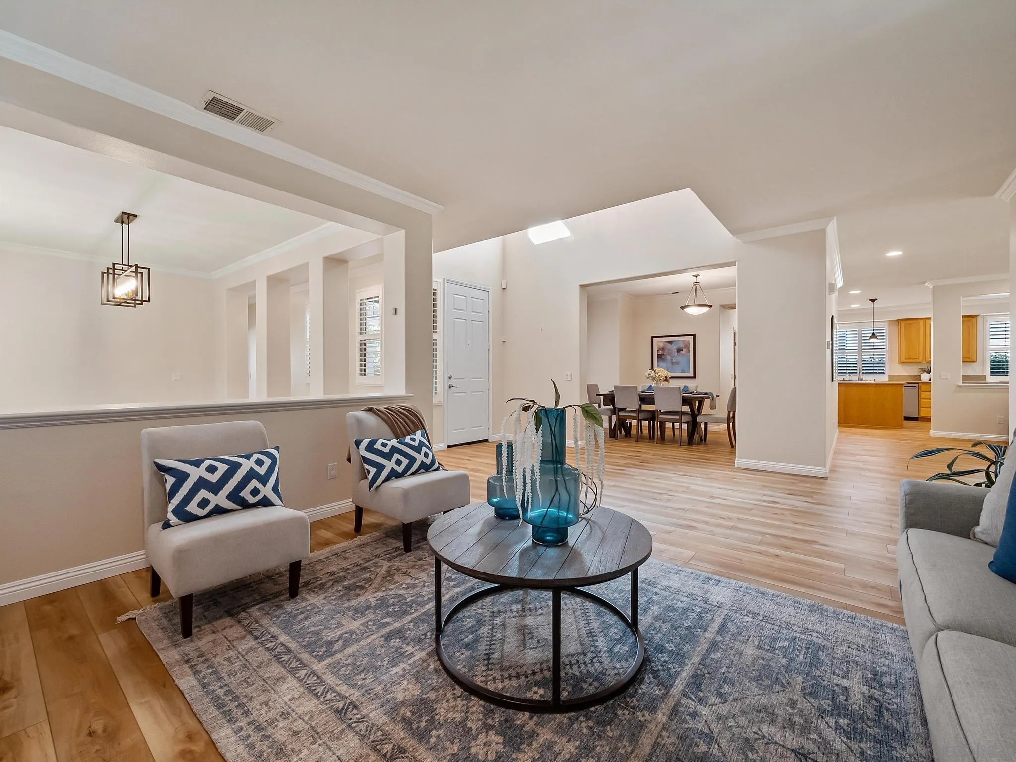 11361 Raedene Way San Diego, CA 92131 - Photo 5 of 57 a living room with furniture and wooden floor