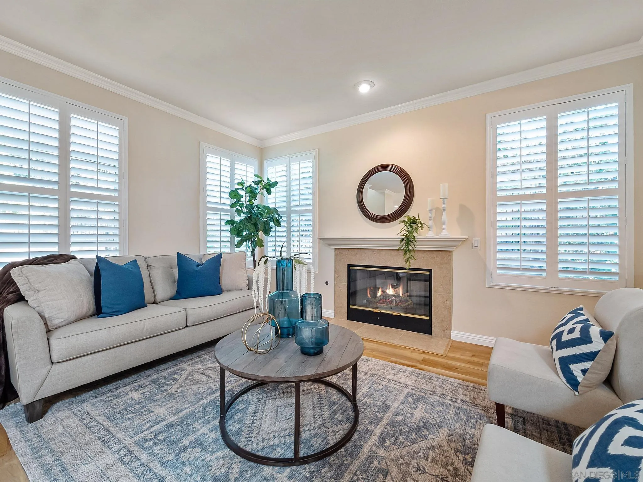 11361 Raedene Way San Diego, CA 92131 - Photo 6 of 57 a living room with furniture a fireplace and window