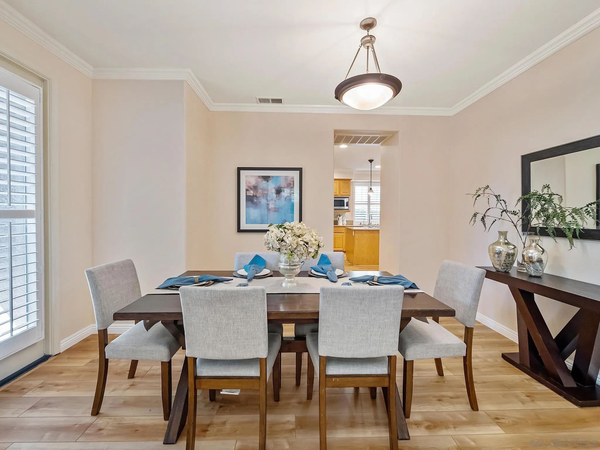 11361 Raedene Way San Diego, CA 92131 - Photo 7 of 57 a view of a dining room with furniture and wooden floor