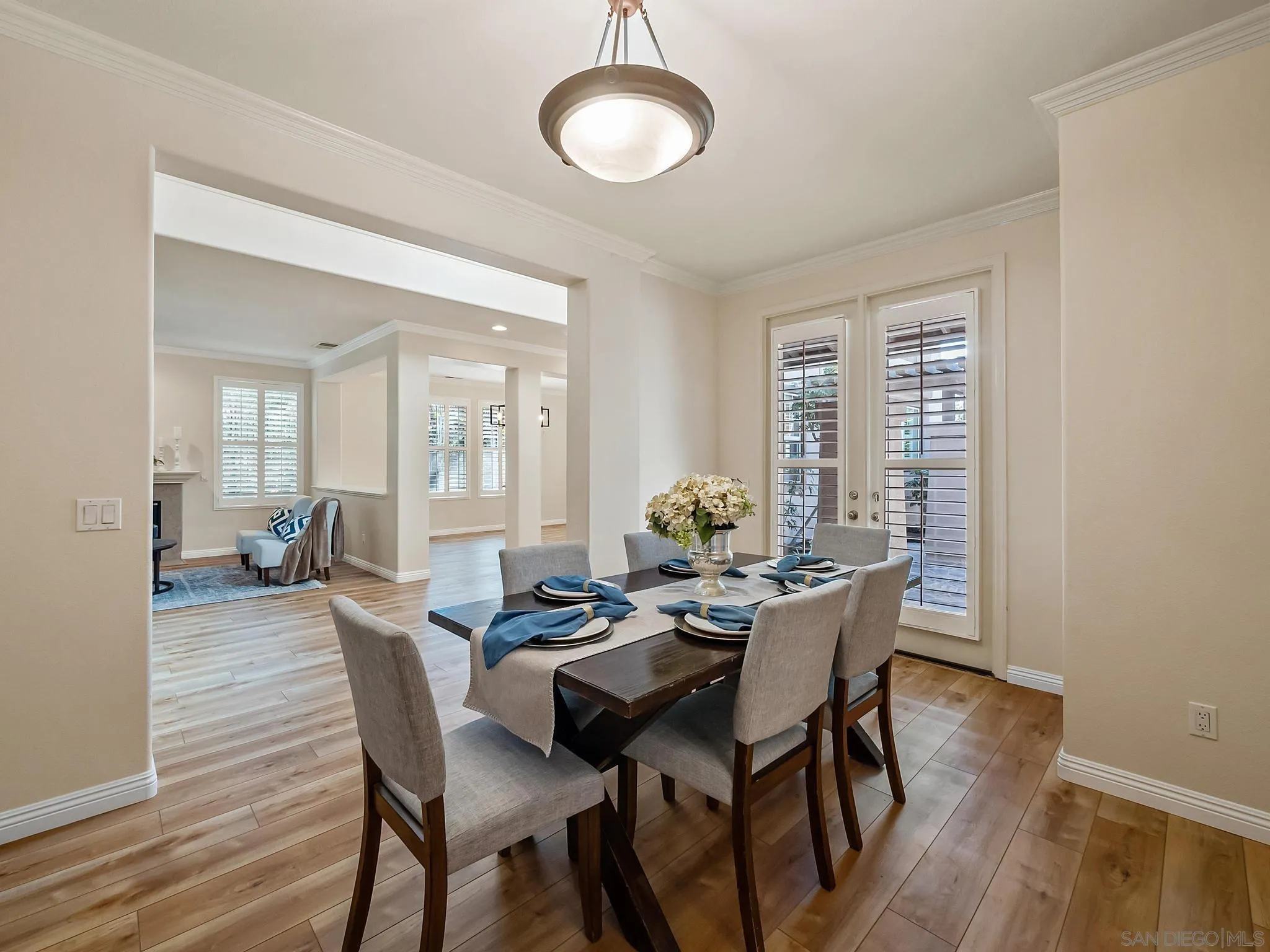 11361 Raedene Way San Diego, CA 92131 - Photo 8 of 57 a dining room with furniture and wooden floor
