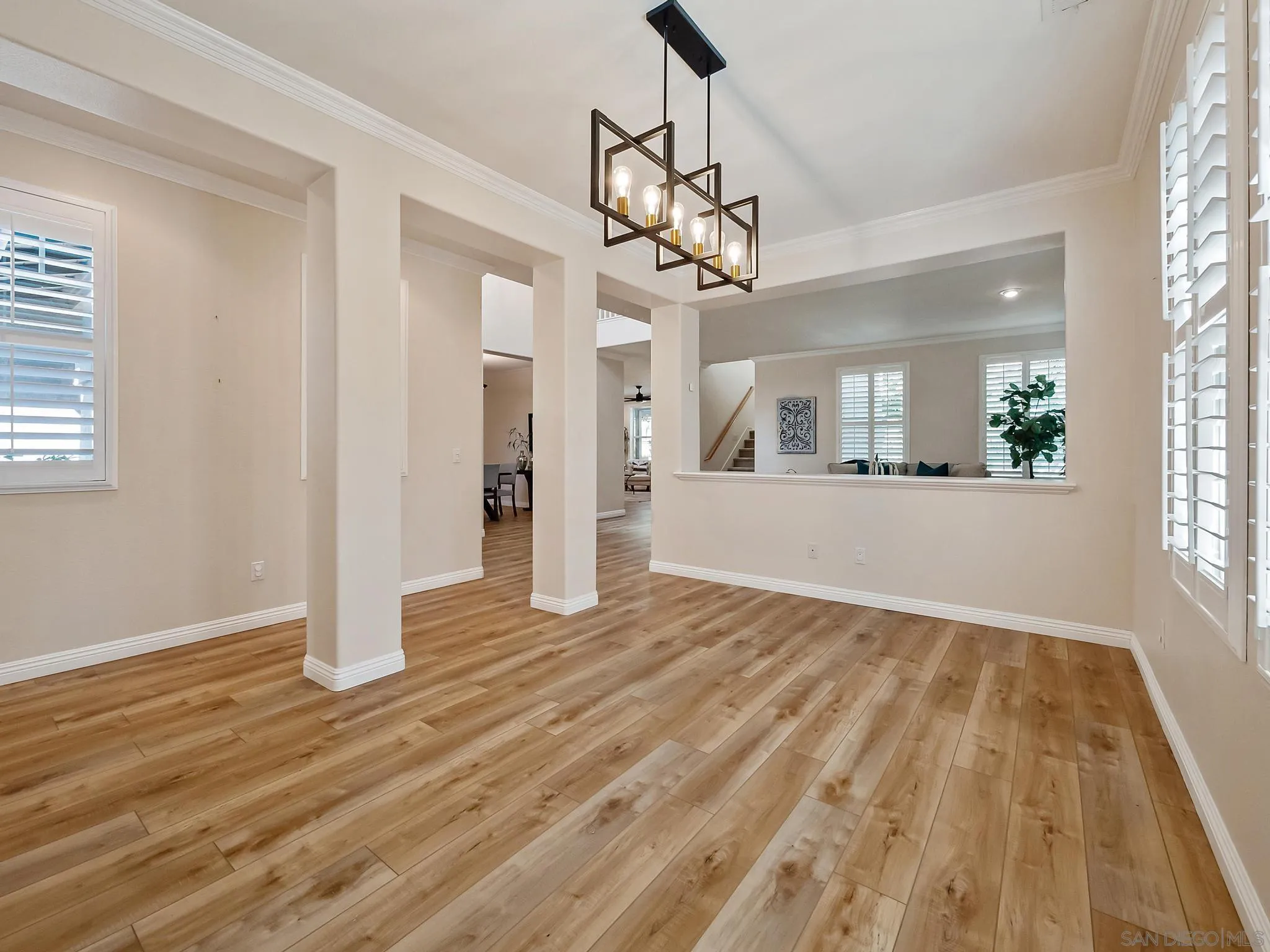 11361 Raedene Way San Diego, CA 92131 - Photo 9 of 57 a view of a livingroom with wooden floor and windows