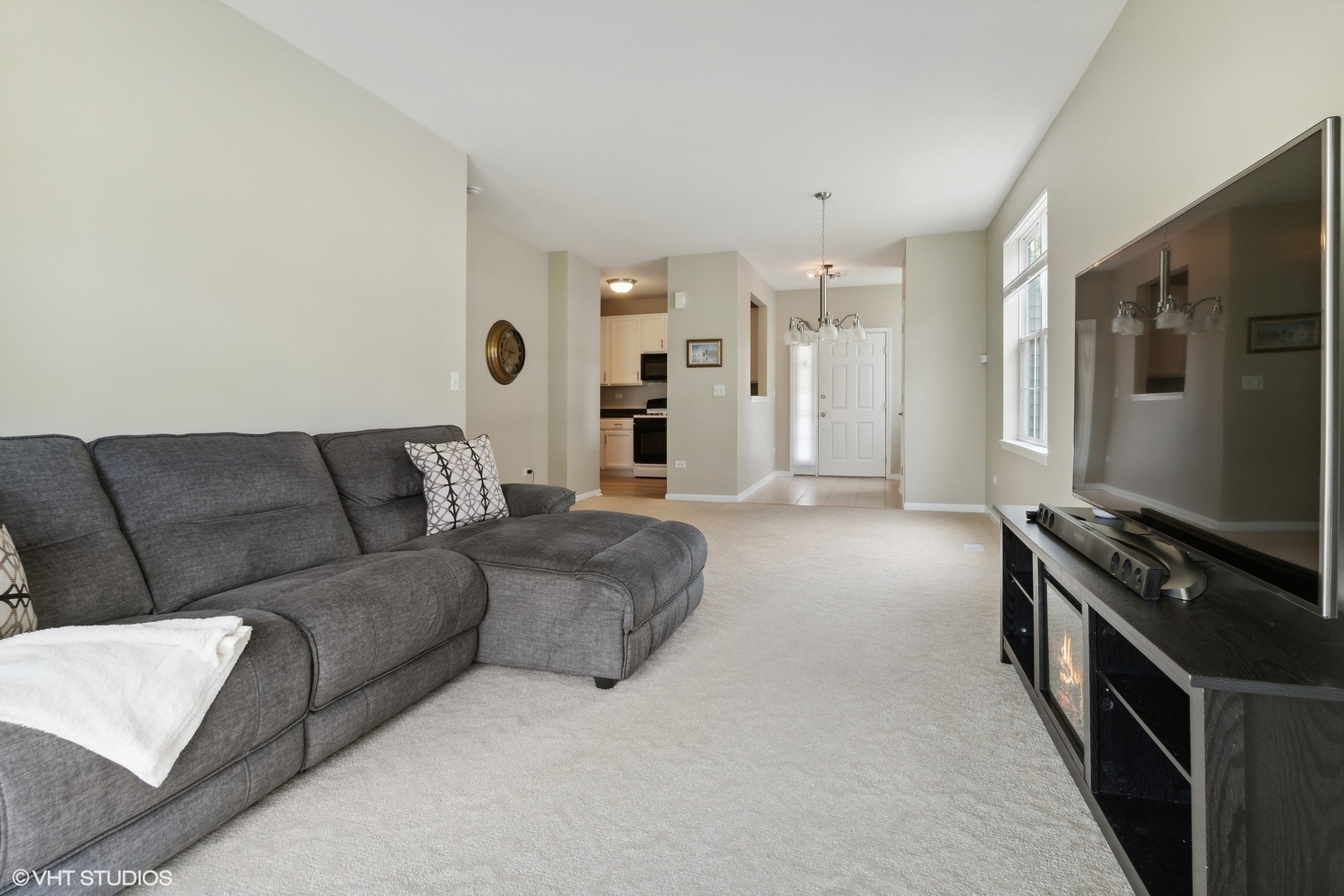 2480 Golf Ridge Circle, Unit 2480 Naperville, IL 60563 - Photo 8 of 15 a living room with furniture and a flat screen tv