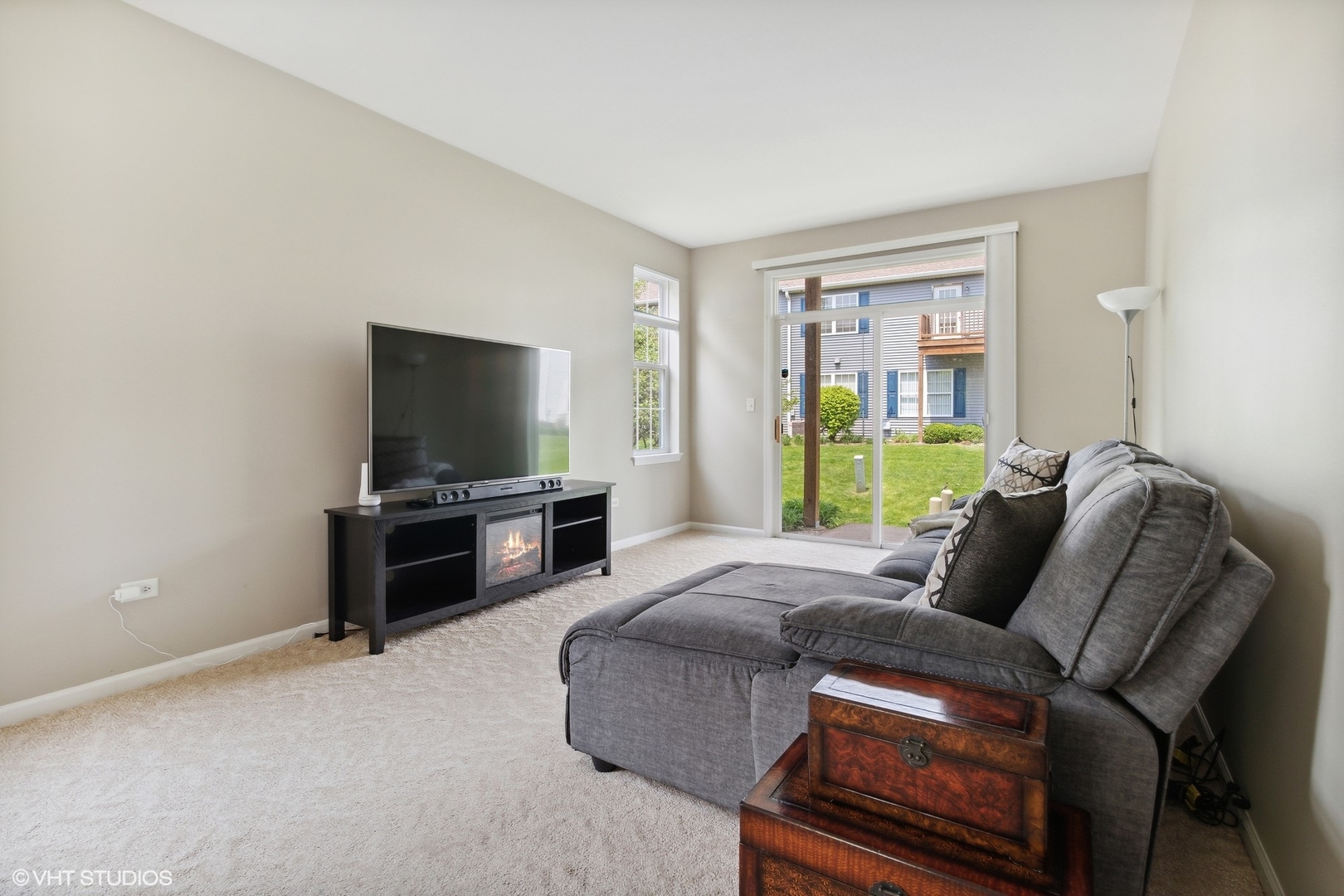 2480 Golf Ridge Circle, Unit 2480 Naperville, IL 60563 - Photo 9 of 15 a living room with furniture and a flat screen tv